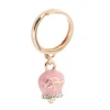 BYSIMON - Anello con campanella portafortuna pendente smalto rosa e cristalli
